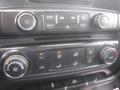 Dashboard controls of a 2015 Chevrolet Silverado 1500 including buttons for radio media temperature and air conditioning settings