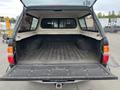 Interior view of the cargo area of a 2004 Toyota Tacoma showing a flat bed and sides without any items inside