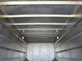 A 2020 Chevrolet Silverado with an empty metallic truck bed featuring walls and a flat floor