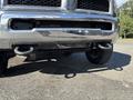 Close-up of the front bumper of a 2014 RAM 5500 showcasing the grille and tow hooks attached to the lower section of the vehicle