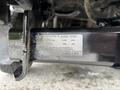 Close-up of a hitch on a 2013 Ford F-250 SD with a label showing weight limits and specifications for towing and load capacity