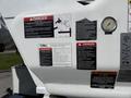 A 2008 International 7500 with various warning labels and safety instructions displayed on its side