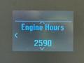 Display screen showing engine hours reading 2590 for a Ford Econoline vehicle