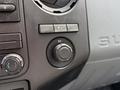Close-up of the dashboard controls of a 2011 Ford F-350 SD featuring climate control dials and a 12V power outlet knob