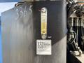 A 2012 Genie Z 45/25 lift with a visible gauge on its side showing fluid levels and an informational label about oil compatibility