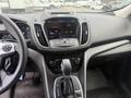 Interior view of a 2014 Ford Escape featuring a digital display panel gear shifter and dashboard controls