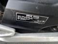 2018 Honda Grom with a focus on the drive chain maintenance label showing instructions for adjustment and lubrication
