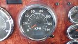 Speedometer of a 2003 International 5600i showing a needle positioned slightly above 60 KPH with additional measurement gauges on the panel