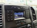Dashboard of a 2018 Ford F-150 featuring a radio display with FM station information and control buttons for audio and climate settings