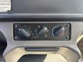 Control panel of a 2014 Freightliner M2 106 with dials for fan speed temperature and air direction