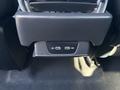A close-up of a car's central console featuring two USB-C ports designed for charging and connectivity
