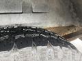 Close-up of a tire on a 2006 Ford Econoline showing tread pattern and texture
