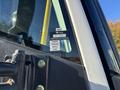A close-up of a 2022 Lion Lion6 vehicle showing a certification sticker with approval details and months listed as January February March April