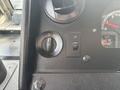 Dashboard controls of a 2018 Ford Econoline including a switch for headlights and a dial for fog lights