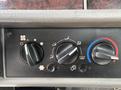 Control panel of a 2013 Kenworth T370 featuring dials for climate control and air circulation settings