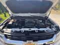 The image shows the engine bay of a 2017 Chevrolet Colorado with the hood raised showcasing the engine and various components inside