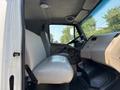Interior view of a 2006 Sterling Acterra showing two white seats and the driver's dashboard with controls
