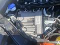 2020 Ford Explorer engine compartment with various components including an electronic control module and wiring harnesses