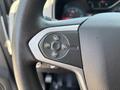 Close-up of the steering wheel controls of a 2017 Chevrolet Colorado featuring buttons for cruise control settings including resume set and cancel options