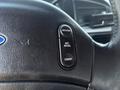 Close-up of a 1995 Ford F-250 steering wheel with buttons labeled Resume Set Accel and Coast