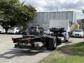 A 2022 Lion Lion6 electric truck chassis with an exposed frame showing wheels and undercarriage components