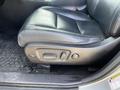 A black leather seat inside a 2018 Toyota Highlander with seat adjustment controls on the side
