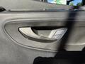Close-up of a door handle and control panel on the interior of a 2023 Mercedes-Benz Sprinter 2500