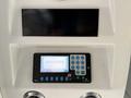 Control panel of a 2016 Grande West Vicinity featuring a digital display and various buttons for operation