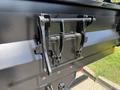 A 2019 Ford F-550 truck's rear tailgate latch mechanism showing metal hooks and a locking system