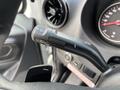 A close-up of the windshield wiper control lever inside a 2020 Mercedes-Benz Sprinter 2500 featuring various symbols for wiper settings