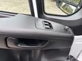 The interior door handle and window control panel of a 2023 RAM Promaster 3500