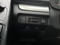 Close-up of the control panel inside a 2016 Subaru Forester featuring various buttons including a mode switch and a lever for adjusting settings