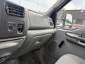 Interior view of a 2004 Ford F-350 SD showcasing the dashboard and control panel with air vents and passenger airbag indicator