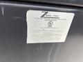 A label from a 2005 Katolight SED60FPJ4 generator displaying information about its capacity and safety requirements