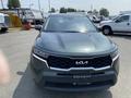 A green 2022 Kia Sorento with a distinctive front grille and headlights facing forward