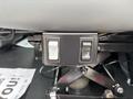 The image shows the control panel of a 2025 Peterbilt 536 with two buttons for seat adjustments mounted under the seat