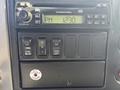 Dashboard of a 2008 International 4400 featuring a digital clock display and several control buttons for features like engine brake and parking brake