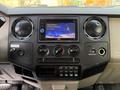 Dashboard of a 2010 Ford F-550 featuring a JVC stereo display with navigation controls and air conditioning vents