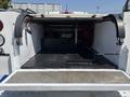 A 2017 Chevrolet Colorado with an open truck bed displaying a clean, empty interior and metal flooring