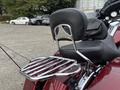 A 2009 Harley-Davidson Road King with a large backrest and a chrome luggage rack attached to the rear seat
