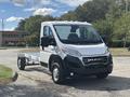 A 2023 RAM Promaster 3500 van in a front view with a chassis cab design showcasing the vehicle's sleek lines and modern features
