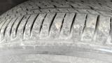 Close-up of a tire from a 2019 Nissan Kicks showing tread patterns and surface details
