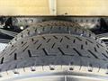 Close-up of a treaded tire from a 2018 Hino 195 showing detailed patterns on the rubber surface