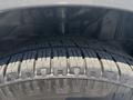 Close-up of a tire from a 2019 Ford Transit 350 showcasing its tread pattern and rubber texture