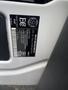 A close-up of a vehicle identification label on a 2024 Mercedes-Benz Sprinter displaying various specifications and a VIN number