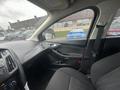 Interior view of a 2018 Ford Focus featuring a black fabric seat and dashboard with controls visible on the center console