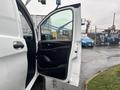 A 2021 Mercedes-Benz Metris van with an open front door revealing the interior and controls