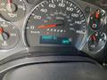 Dashboard of a 2011 Chevrolet Express showing speedometer fuel gauge temperature gauge and odometer reading 340497 km at 38 degrees Celsius