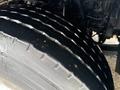 Close-up of a 2016 Freightliner 108SD tire showing deep treads and a rugged surface designed for traction and durability