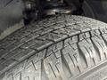 A close-up of a tire on a 2021 Toyota 4Runner showcasing the tread pattern and texture of the rubber